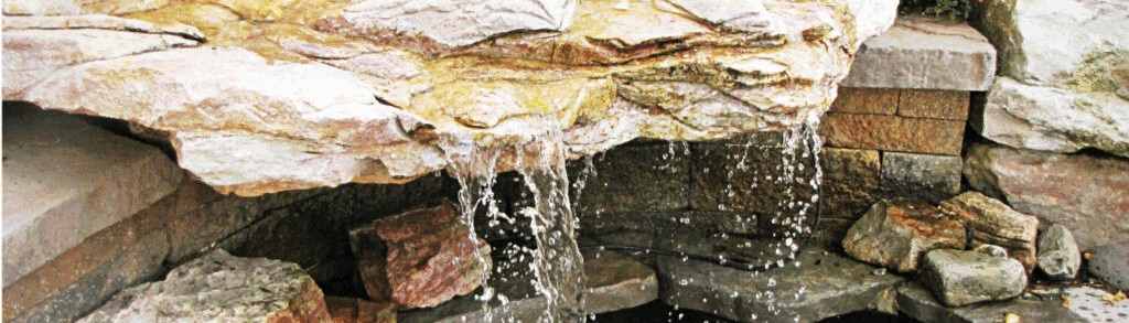 water feature on a brick retaining wall